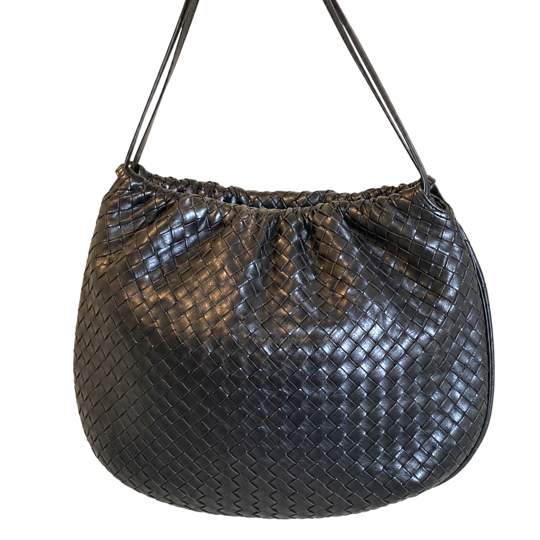 Vintage Bottega Veneta Black Intrecciato Leather Drawstring Bag: Note wear to the inside of bag. Measures 9 1/2"H x 11 1/2"W. Strap drops 16". Please review photos for more details as they are a part of the description. Item is being sold as found from an estate