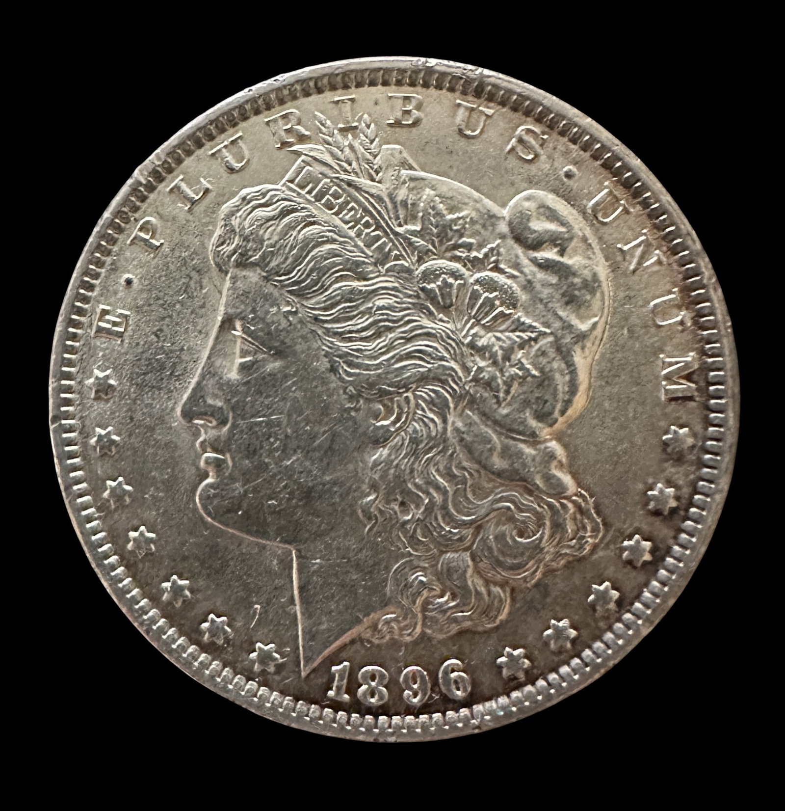 1896 Morgan Silver Dollar: Please review photos for more details as they are a part of the description. Item is being sold as found from an estate collection and may show signs of age, use, wear, imperfections, or surface
