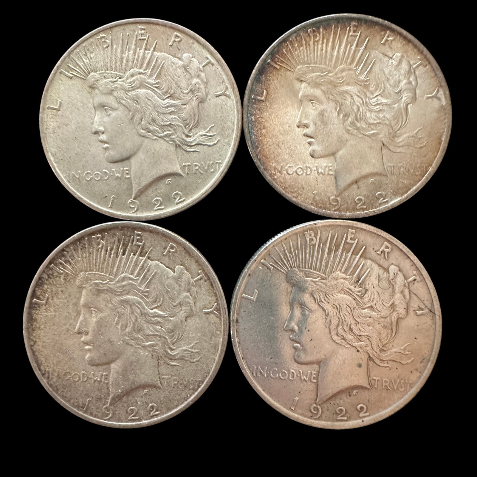 Four 1922 Peace Silver Dollars: Please review photos for more details as they are a part of the description. Item is being sold as found from an estate collection and may show signs of age, use, wear, imperfections, or surface