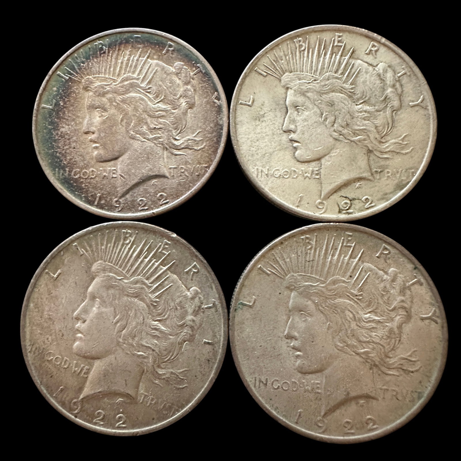 Four 1922 Peace Silver Dollars: Please review photos for more details as they are a part of the description. Item is being sold as found from an estate collection and may show signs of age, use, wear, imperfections, or surface