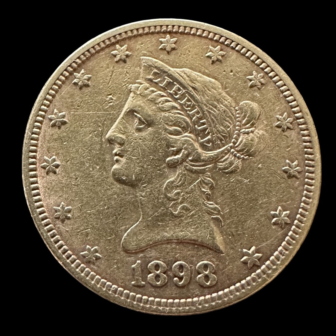 1898 Ten Dollar Gold Coin: Please review photos for more details as they are a part of the description. Item is being sold as found from an estate collection and may show signs of age, use, wear, imperfections, or surface