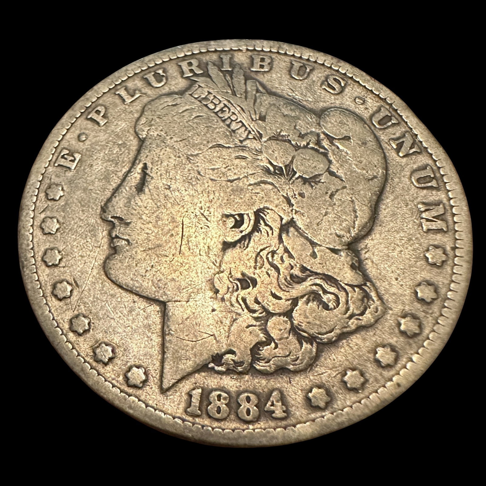 1884 Morgan Silver Dollar: Please review photos for more details as they are a part of the description. Item is being sold as found from an estate collection and may show signs of age, use, wear, imperfections, or surface varia