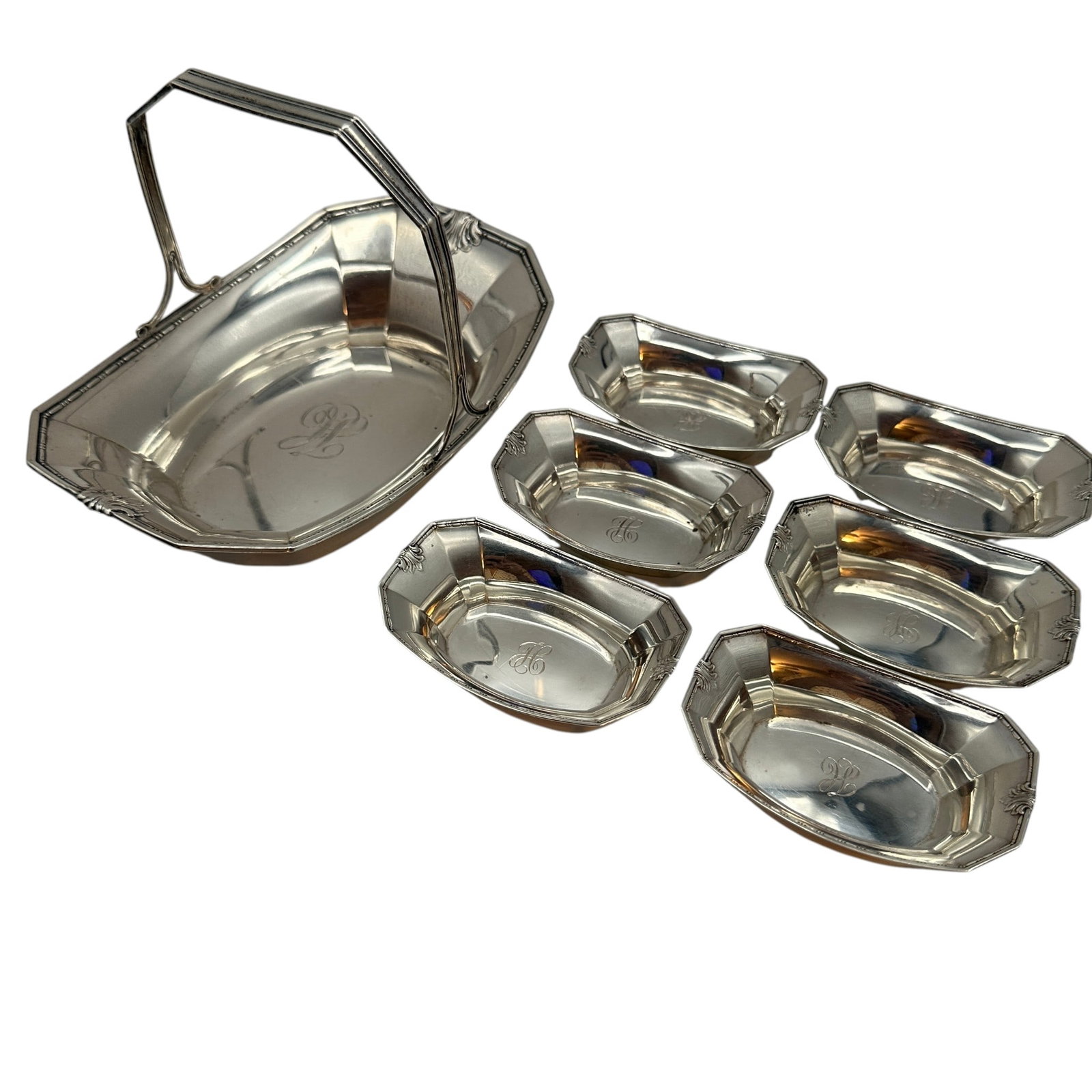 Vintage Sterling Silver Nut or Candy Bowl with 6 Nut Cups: Total weight 247 grams. Basket measures 6 1/2"L x 4 1/4"W x 4 1/2" tall to the top of the handle. Small bowls measures 3"L x 2"W x 3/4"H. Please review photos for more details as they are a part of th