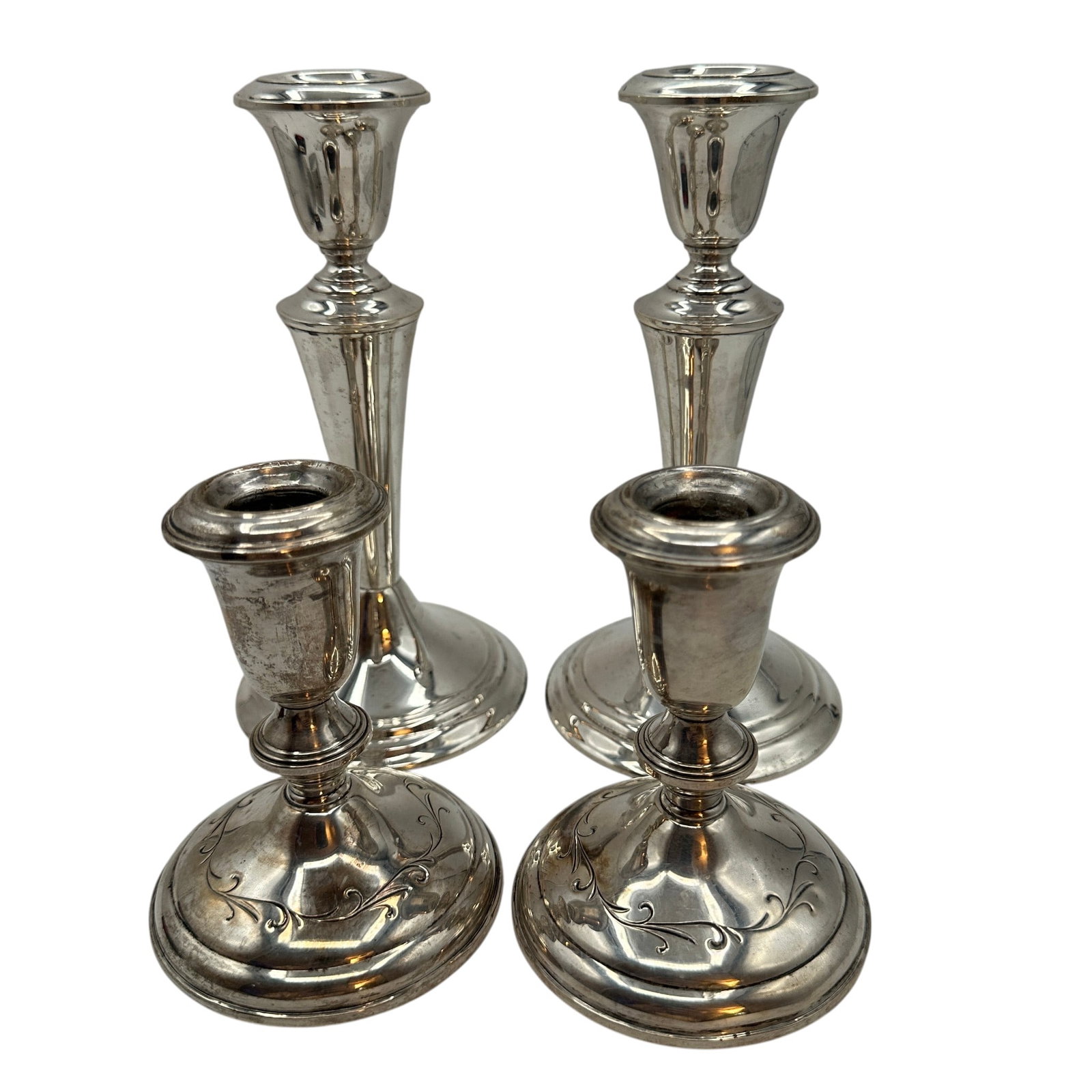 2 Pair of Weighted Candlesticks: Includes Gorham and Towle weighted cnadlesticks. Shorter candlesticks measure 4 1/2"H and taller candlesticks measure 7 1/2" tall. Bases measure approximately 3 1/2" diameter. Please review photos for