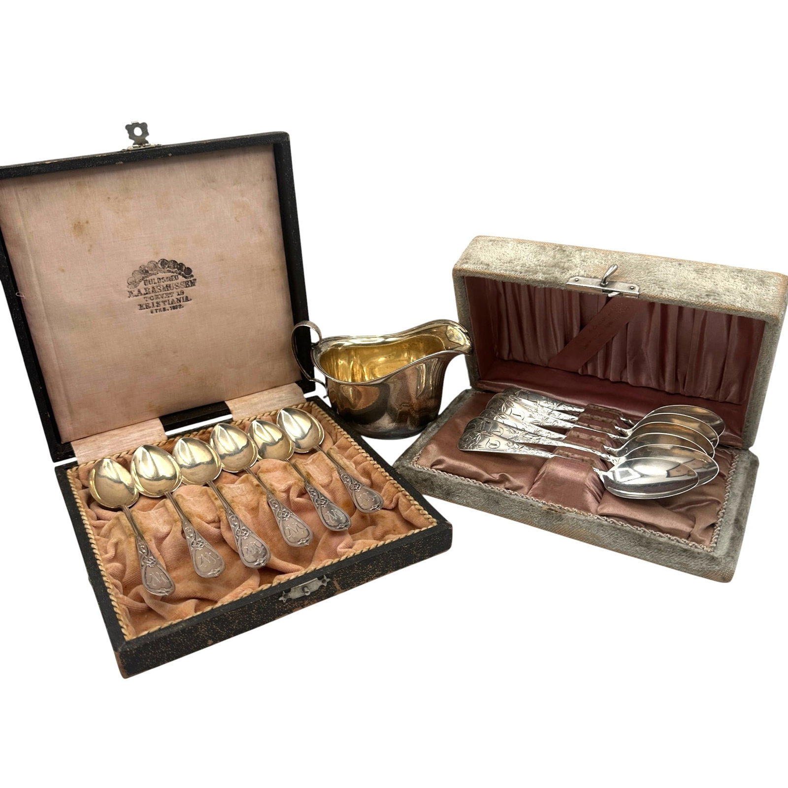 2 Boxed Sets of Silver Spoons with a Creamer: One set of spoons is marked 830 silver purity weighing 96 grams. A second set of sterling silver spoons weighing 73 grams, and a sterling silver creamer weighing 58 grams. Please review photos for mor