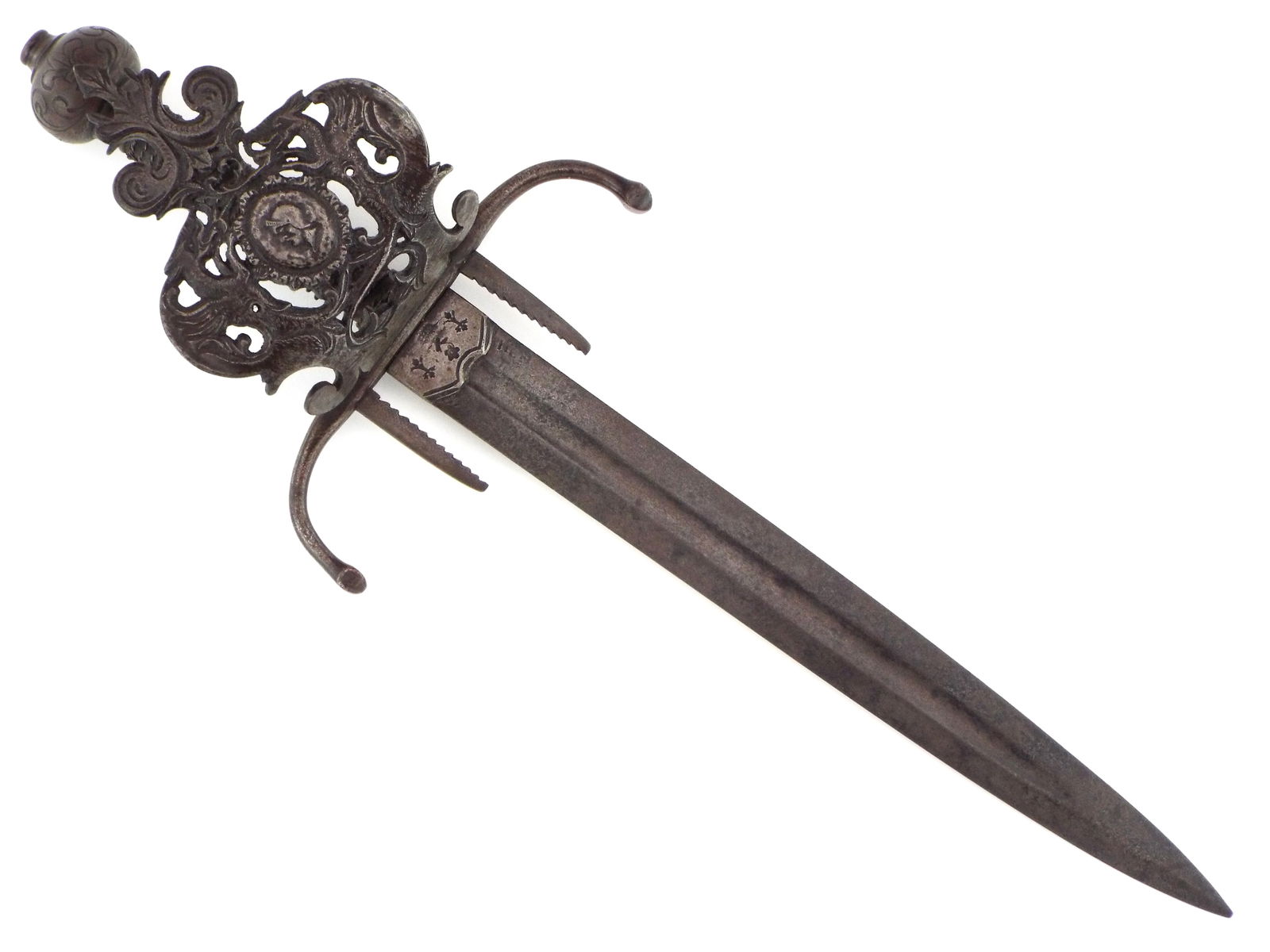 Scarce Massive Spanish Or Italian Sword Breaker, Left Hand Dagger, Main Gauche.: Scarce Massive Spanish or Italian Sword Breaker, Left Hand Dagger, Main Gauche. Presenting saw tooth sword breakers flanking the base of the blade, an open work hilt showcasing an ornate armorial with