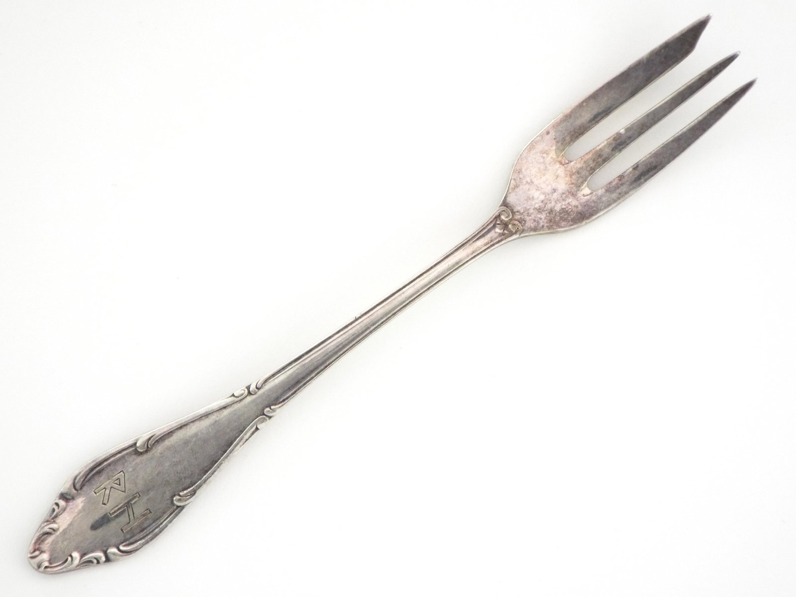 German WWII silver salad fork which belonged to Reinhard Heydrich by WELLNER: German WWII silver salad fork which belonged to Reinhard Heydrich by WELLNER that made famous Hitler silverware A H monogram. Many party officials bought silver serviced from same company.