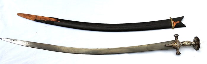 An exquisite late18th -early 19th C. Mughal Indian talwar with the hilt embellished