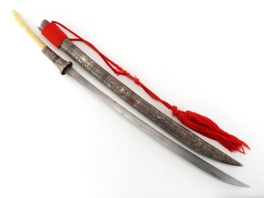 Burmese Dha in silver ornamental scabbard, exquisitely embossed with traditional early Burmese