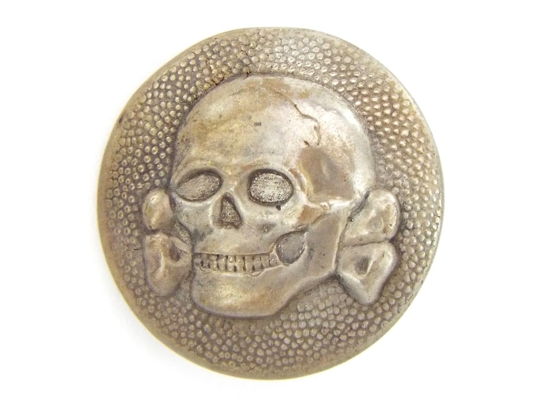 German WWII Verteidigungstruppen Early Waffen SS Garrison Cap Skull. .: This is an early nickel plated tombak variant button which is properly made and marked.Condition is very good with some rubbed areas where the tombak base metal can be seen peeking through From Major 