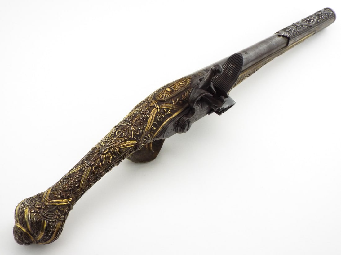 Outstanding Quality 18th C. Ottoman Greek Flintlock Pistol in Deeply Carved Gold Gilt Silver Mounts: The stocks fully covered with extremely fine gold gilt chiseled silver .Full Length 20 inch