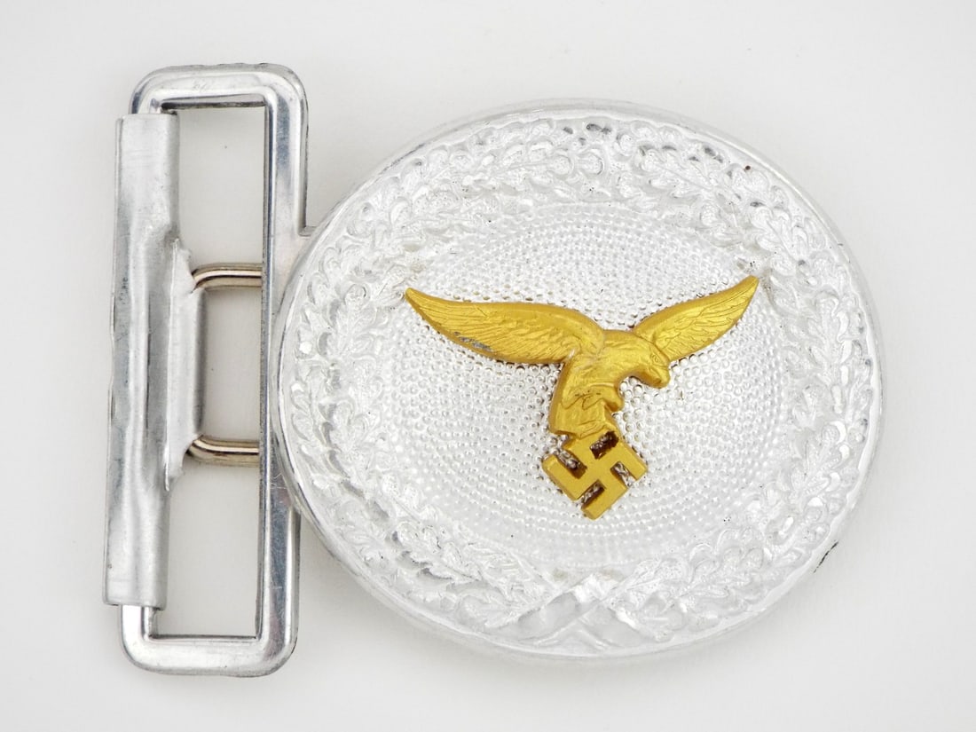 MINT German WWII Luftwaffe Officers Belt Buckle: Third Reich era German Luftwaffe Officers belt buckle worn with the brocade dress/parade belt. OLC maker marked this die stamped aluminum buckle displays a riveted in place first pattern droop tail LW
