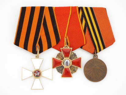 Extremely Rare Imperial Russian Medal Bar: An Imperial Russian medal bar comprised of a 4th Class Order of St. George in enameled gold with St. Petersburg hallmark, a 3rd Class Order of St. Anne in enameled gold stamped with a Cyrillic hallmar