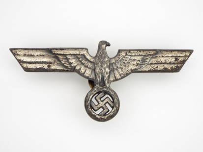 German WWII Spelter National Eagle: national eagle device is designed for use on metal or wood presentation or patriotic plaques. The eagle is silver plated spelter and is still equipped with its original mounting hardware. Authenticity
