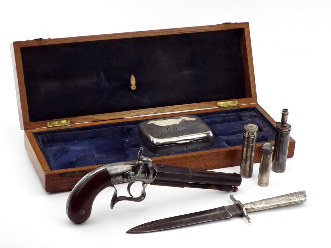 Unique Cased 2 Piece Long Barrel Large Caliber Percussion Pistol.: Unique Cased 2 Piece Long Barrel Large Caliber Percussion Pistol. Very Tight Action And Vg Condition With Traces Of Original Bluing . Large Silver Plate Accouterments Case Engraved Ruby On Top And Nic