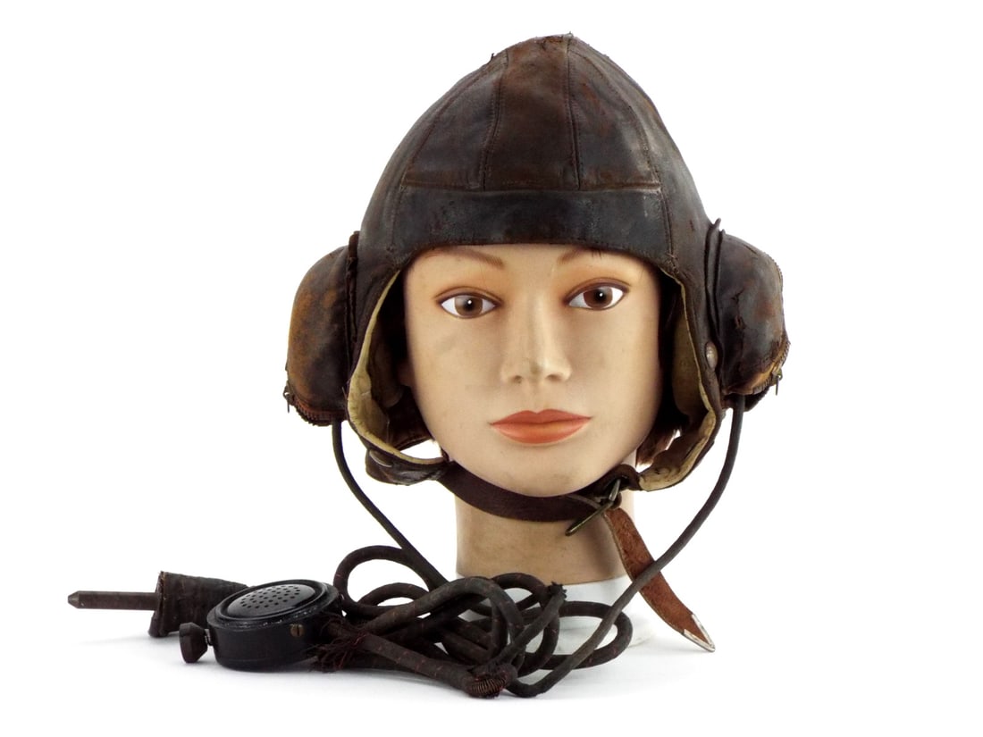 WWII RAF Type B Leather Flight Helmet: An excellent World War II Royal Air Force Type B leather flight helmet with a great maker label - Air ministry marked 1941. Also has the pilots name written in ink along the inner base which is unrese