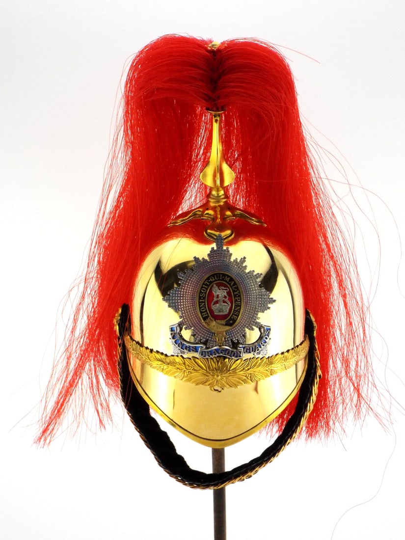 Stunning Miniature Kings Dragoons Helmet: A minty softball size King's Dragoon Guards miniature helmet in absolutely outstanding condition, not a scratch or dent present. Very heavy construction, beautiful enamel badge on the front in enamel.