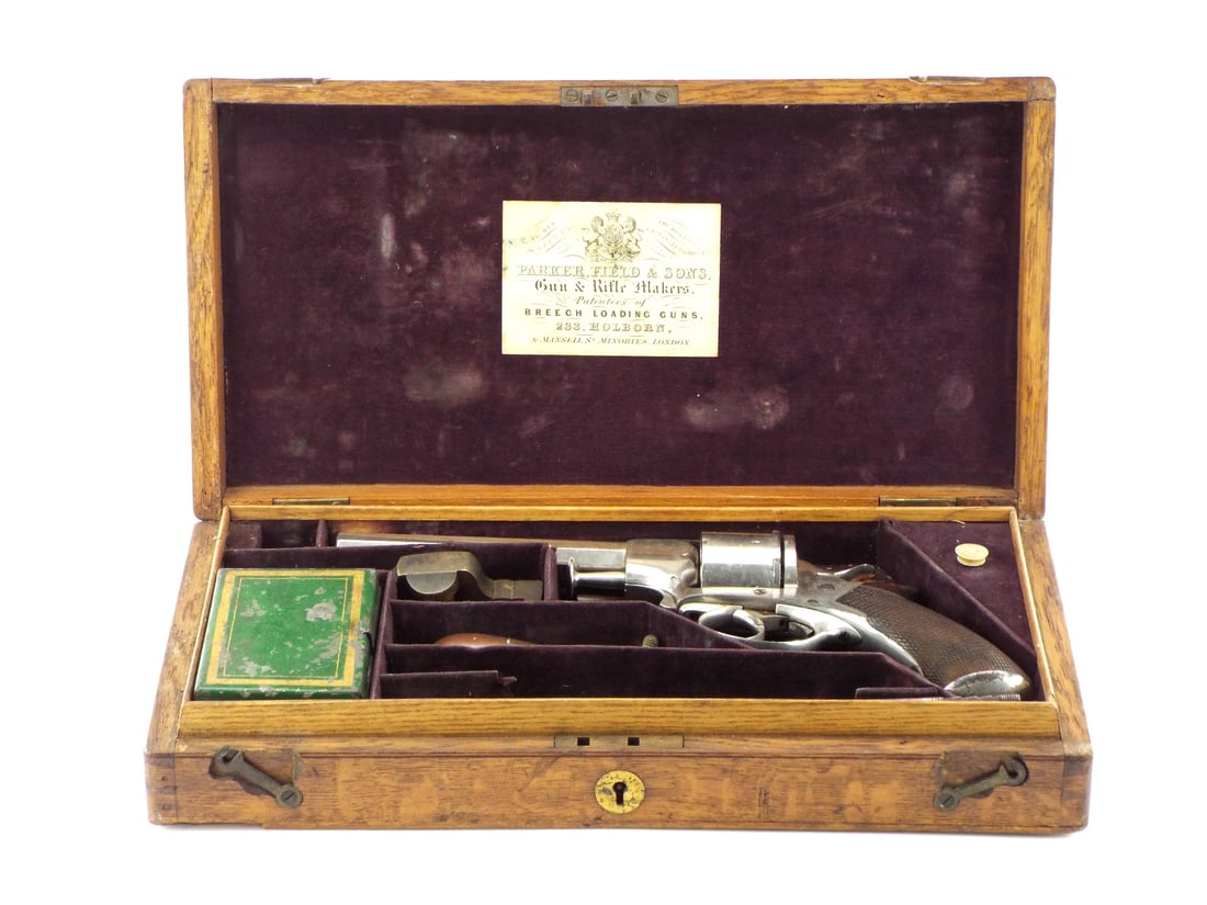 Identified Cased British Tranter Type Revolver: An excellent Tranter Type type revolver identified to S. Diamond of the 13th Hussars. In very good condition in original case with accouterments and original Parker Field & Sons label in lid. Likely p