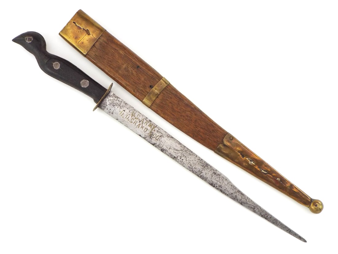 WWII US Army Philippines Souvenir Knife: WWII US Army Philippines Souvenir Knife. Single edged blade marked “U.S. ARMY” and “D.D. SRAKU & CO.” beneath gilded highlights. Tang sandwiched between dark hardwood grips secured by