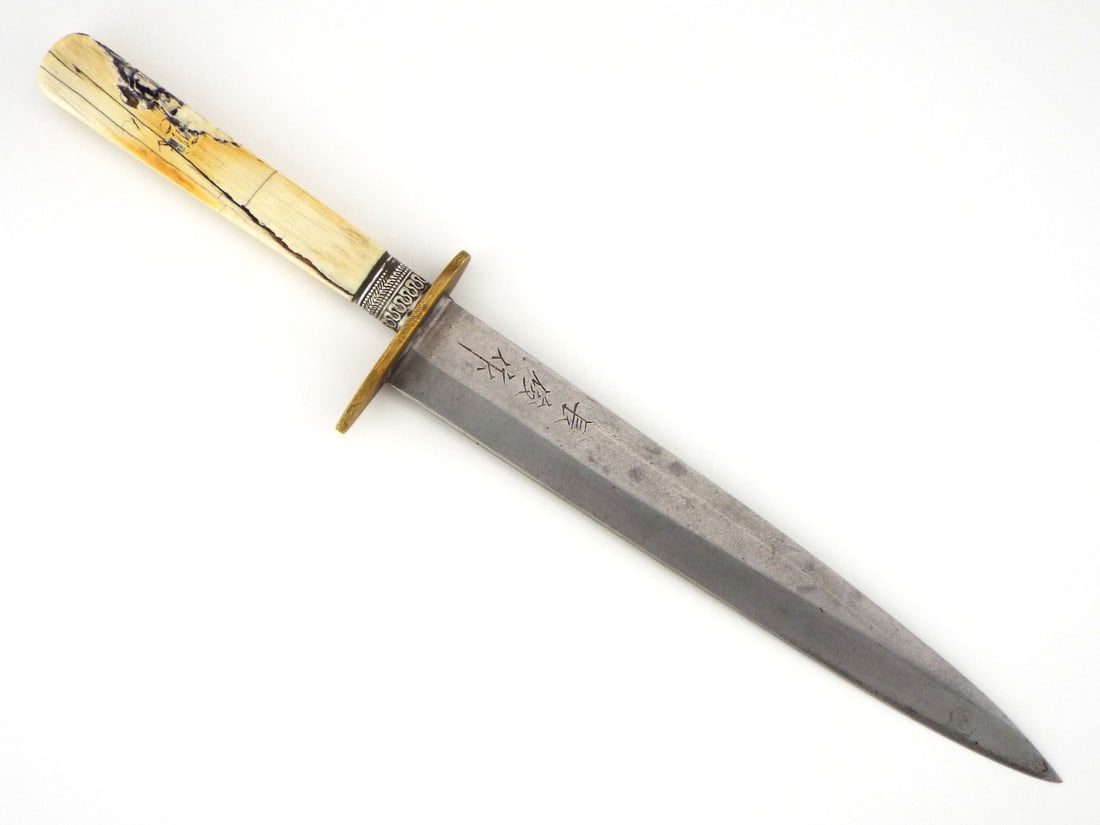 Showa Period Japanese Nagatoshi Tanto Fine Bone Handle: Showa period Japanese tanto knife by Nagatoshi. Single edged blade with one flat face and raised opposite displaying Japanese Kanji inscription: "Naga Toshi Saku" ("Made by Nagatoshi"), maintaining sh
