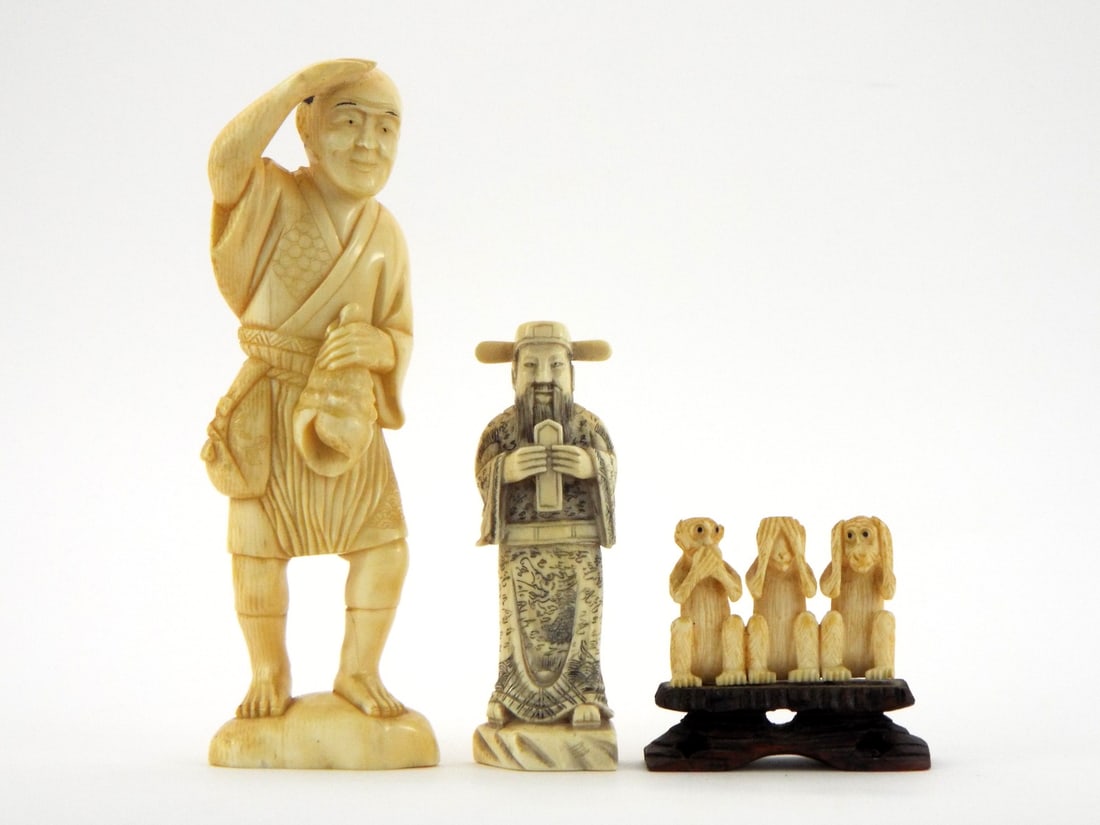 19th Century FINE Bone Japanese Carvings: 19th century Japanese group of three fine bone carvings. The largest depicting a fisherman shading his eyes while carrying a conch shell, the second a bearded scholar holding a scroll with inked calli