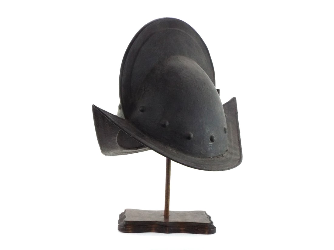 16th-17th C. Style COMB MORION High Crest Riveted Brim Antique Helmet: 16th-17th century Style Spanish comb morion helmet. The one piece skull rises to tall comb with pronounced almond shape. interior rivets and frontal plume socket intact. Wide brim with a crack on the