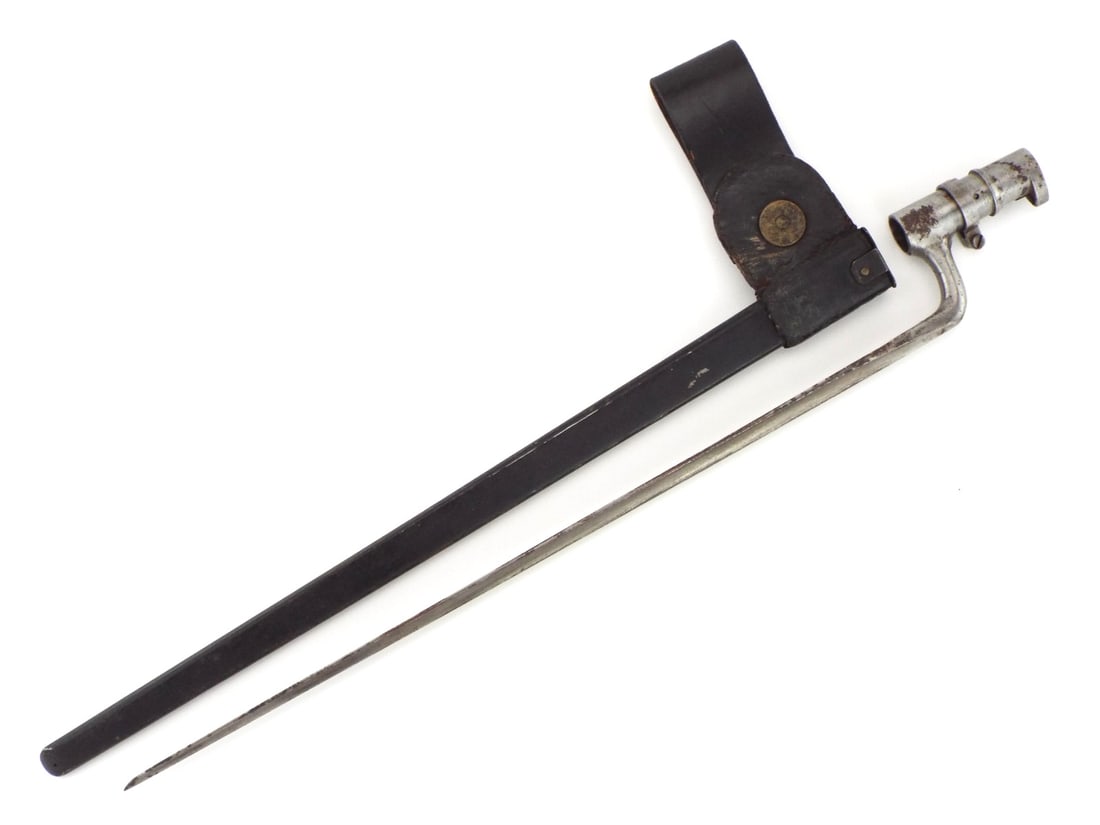 US MODEL 1873 BAYONET with McKenney Scabbard: U.S. Model 1873 socket bayonet with a triangular blade, locking ring and bridge under greyish patina. This combination is a classic piece of the Indian Wars era (circa 1873-1890's) used primarily with