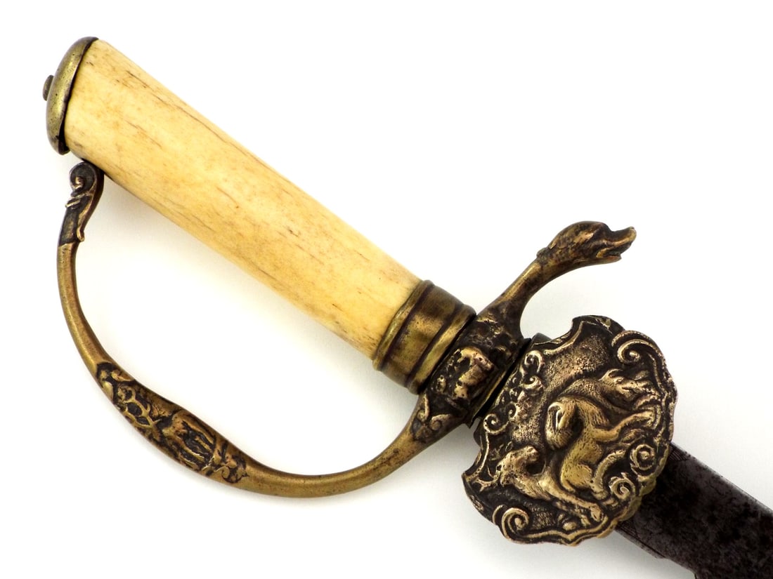 18th C. French HUNTING SWORD Bone Grip: 18th century French hunting hanger sword. The single edged blade richly engraved with running boards beneath oak branches and leaping stags in a forest clearing, signed in ribbon “Ne Me Mettez