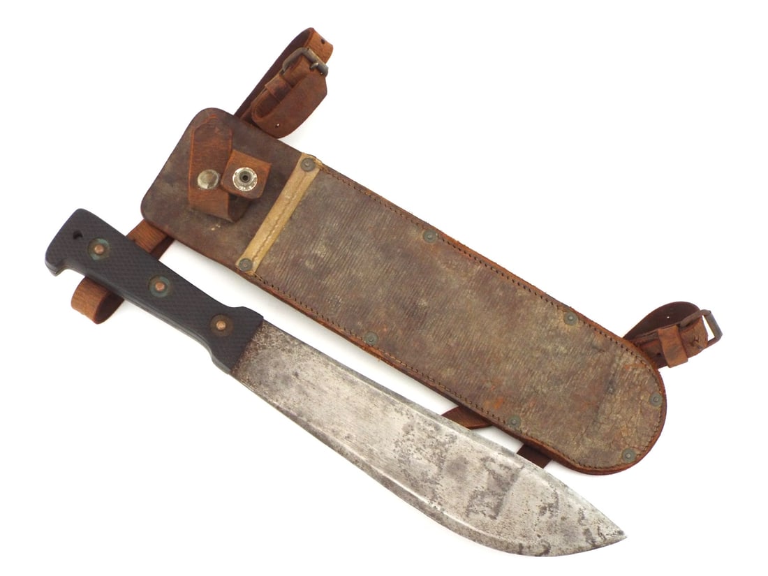 Rare 1943 British WWII MACHETE With Leather Scabbard: Rare 1943 British machete jungle knife boasts a double edged blade marked with the iconic alligator and Martindale registered, revealing some runner marks from fair condition use under greyish