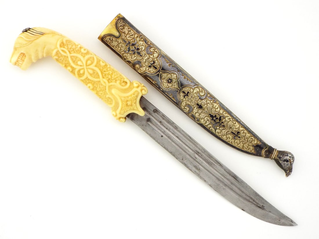VERY FINE 19th C. Russian Caucasian KNIFE Silver Niello Work: An extremely refind Silver mounted Russain Caucasian knife. Featuring a single edged blade with three fullers, its greyish patina remembering centuries of Cossack tales. VERY FINE and delicately carve