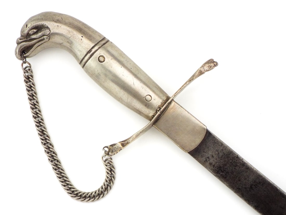 Fine 19 C. SPANISH COLONIAL SILVER HILTED OFFICER'S SWORD: Fine 19 C. SPANISH COLONIAL SILVER HILTED OFFICER'S SWORD. Sun scorched frontier iron straight single edge blade with angular tip, wide fuller on both faces, grey patina with some spotting. Silver hil