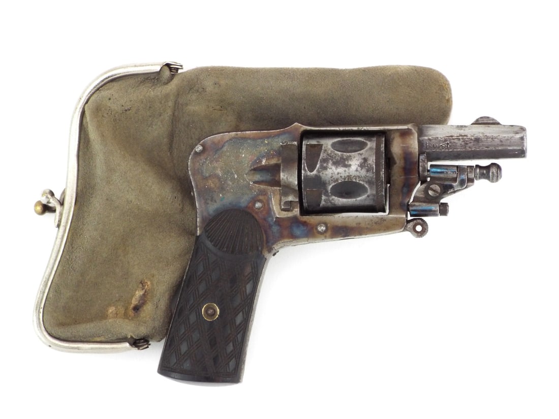 Elegant Late 19th Belgian VELO DOG POCKET REVOLVER in Chamois Purse: Miniature Belgian Velo Dog pattern hammerless pocket revolver chambered in 6.35mm caliber exemplifies the discreet self defense arm favored in the belle epoque era when personal protection often deman