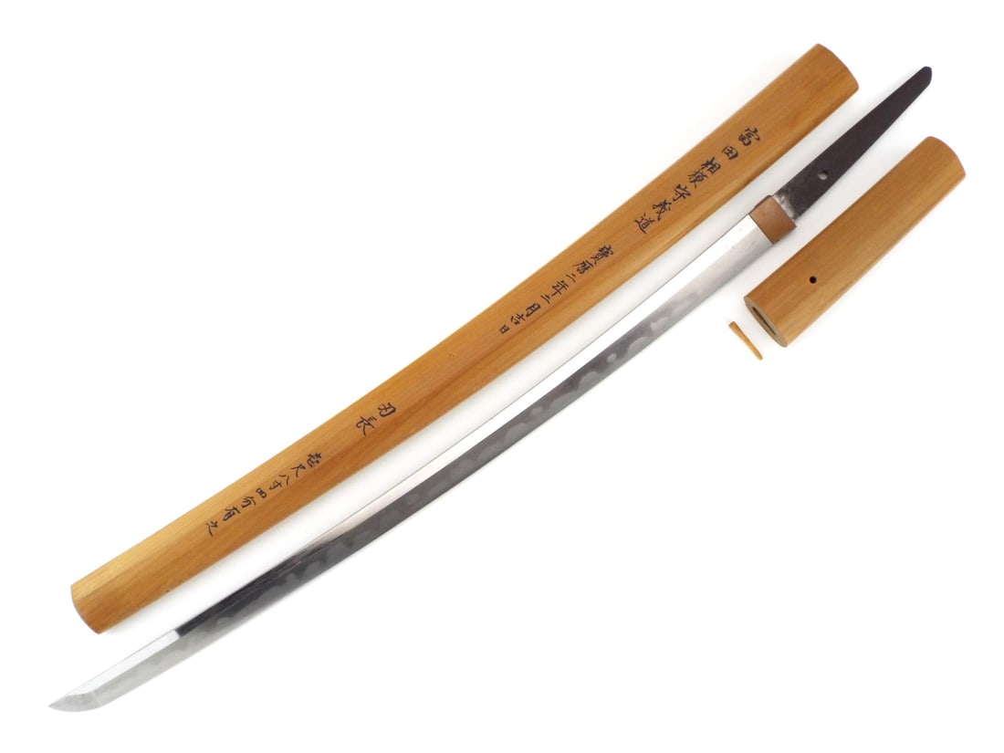 Masterful Mid Edo Japanese WAKIZASHI SWORD Shirasaya & Sagami no Kami Signature: Evocative artifact of the Horeki era, this fascinating mid 18th century wakizashi represents the technical pinnacle of the Mishina school’s enduring legacy. The blade, exhibiting a vibrant and crisp