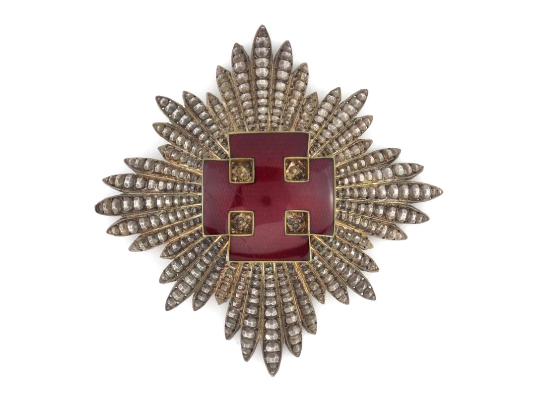 Austrian Second Republic Star ANTON REITTERER Silver Enamel: Eight pointed faceted star body exhibits a deep, even patina across its silver gilt rays, supporting a magnificent central Greek cross in flawless oxblood vitreous enamel. The reverse features the cri