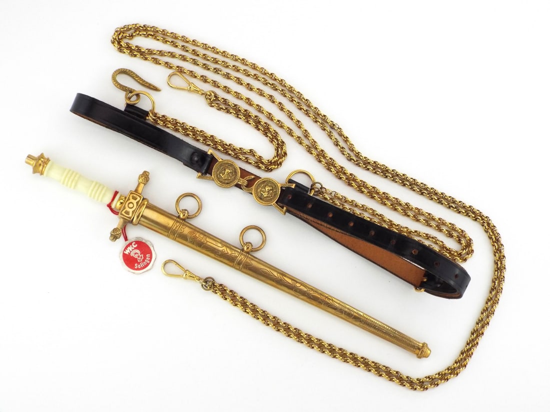 Very Good Royal Dutch Navy Officer Dagger By WKC With Belt & Chain: Royal Dutch Navy officer's dagger Model 1888. Straight double edged etched blade, crafted by Weyersberg, Kirschbaum & Co. (WKC) of Solingen, the blade bears the distinctive knight's head logo on the r