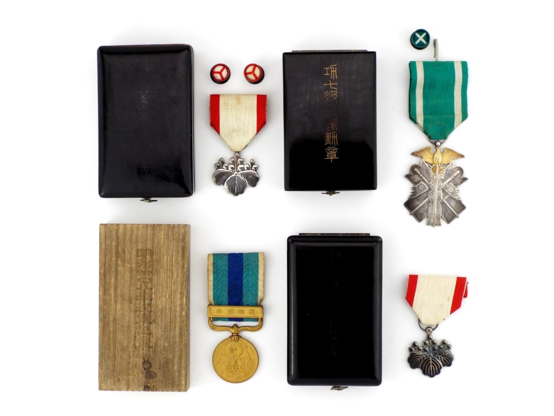 Japanese WWII & Russo-Japanese War MILITARY ORDERS: Group comprising a 7th Class Order of the Golden Kite in silver with gilded raptor, showing light toning. Includes a 7th Class Order of the Paulownia Leaves with some green enamel and an 8th Class sil