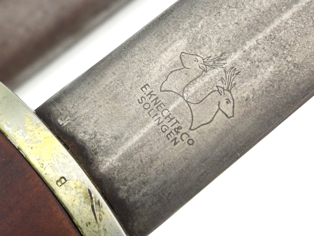 Very Rare Maker Early German WWII SA DAGGER By KNECHT SOLINGEN: Early production blade displays a vivid "Alles fur Deutschland" etch translating to "Everything for Germany" and the lucrative E. Knecht & Co. maker mark, showing honest wear and a mellowed patina. Th