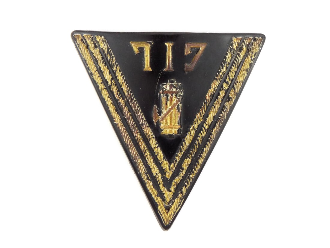WWII Italian GIL YOUTH BADGE: Gioventu Italiana del Littorio triangular badge, black painted celluloid displaying crisp raised “GOLD” lettering and central fasces in bold relief. Rope chevron borders show honest age mellow