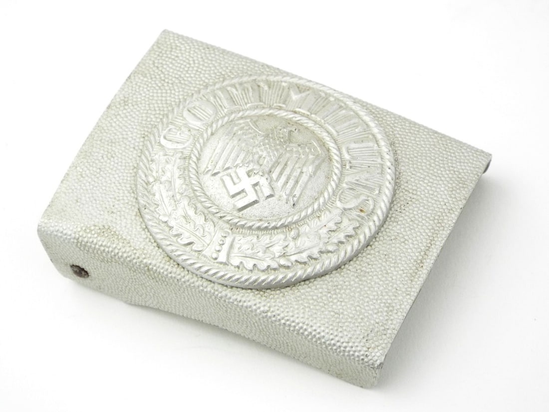 German Early WWII ARMY BELT BUCKLE in Stamped Aluminum: Aluminum body with sharp detailing to the strike, reverse shows an intact steel pin bar with dual prongs. Uniform silver grey finish remains bright with minimal wear, light oxidation to the reverse ha