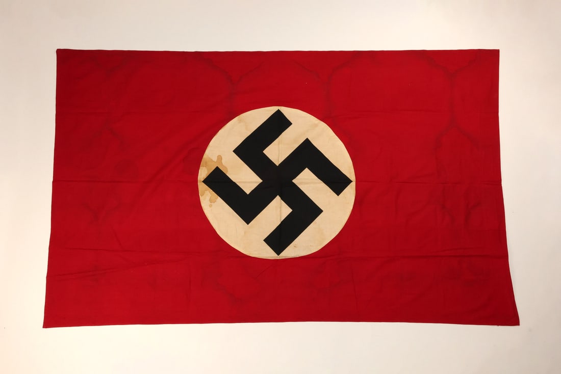 HUGE German WWII Flying POLE FLAG Banner Cotton: Cotton body displays a deep red field centered by a multi piece white roundel and stitched ensign, exhibiting significant atmospheric patina and localized foxing consistent with period display. The te