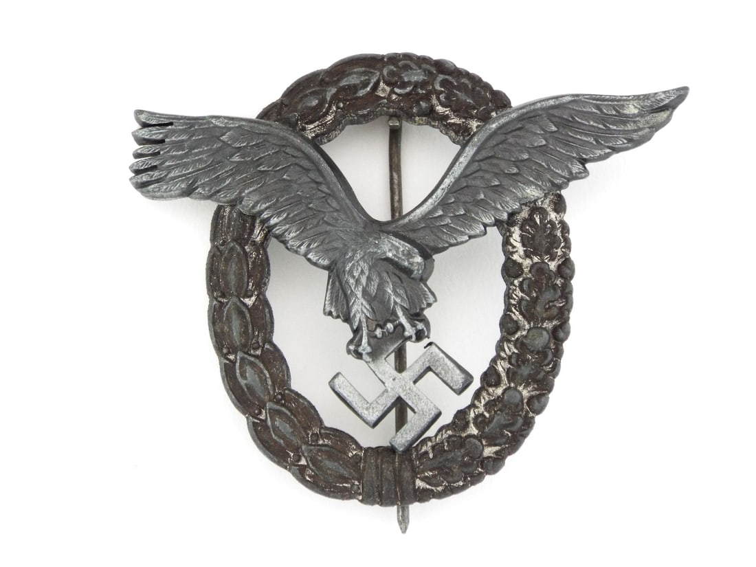 German WWII Luftwaffe PILOT BADGE Unmarked: Wreath displays dark oxidized patina with significant loss to original silver wash. High relief eagle secured by two dome headed rivets shows light wear to feathering and talons. Reverse hardware cons