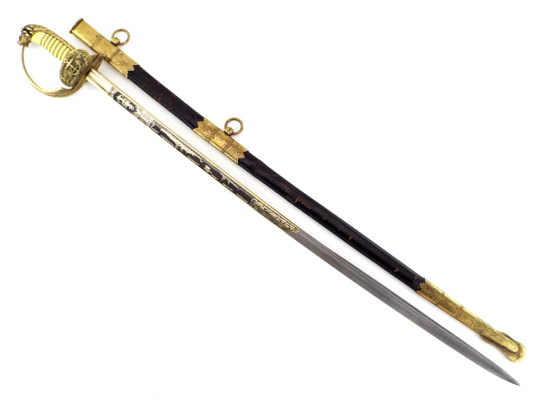 Very Fine German WWII Naval Officer's Sword By ALCOSA Etched DAMASCUS Blade: Very fine Alcosa manufactured blade exhibits gilded etching depicting naval vessels and oak leaf clusters alongside a Reichsadler with fouled anchor motif in remarkable preserved condition. The gilded