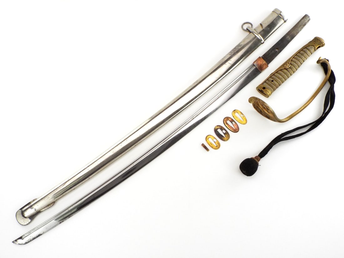 Sino Russian War IJA Kyu Gunto Sword with Forged Blade: Hand forged Japanese Army Officers Kyu Gunto sword as used during the Sino Russian war all the way into WWII. This blade remains in good condition with no fatal flaws and a dent free scabbard. The tip