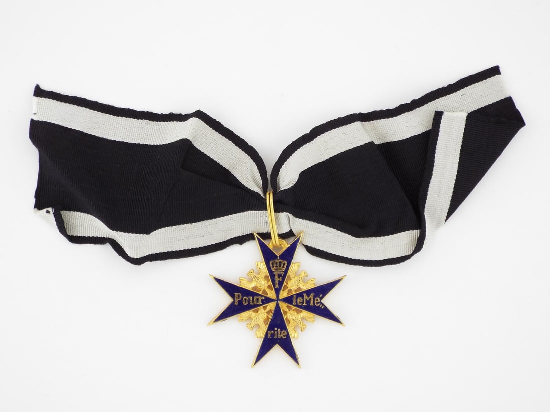 Museum Quality Prussian WWI ORDER OF MERIT MILITARY CROSS: Museum quality piece, body displays very minor surface abrasions and softening to the casting details. Translucent blue cold enamel remains intact. Obverse bears crisp F monogram and motto in excellen