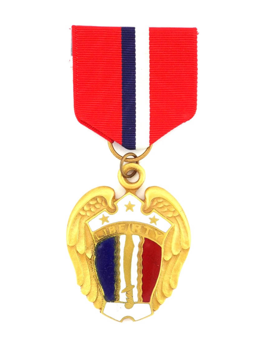 US WWII Merchant Marine PHILIPPINE LIBERATION RIBBON Enameled Shield: Fine example of the Philippine Liberation Ribbon, the planchet exhibits a gilded bronze finish with an obverse bearing a white enameled banner inscribed LIBERTY above a shield featuring a traditional