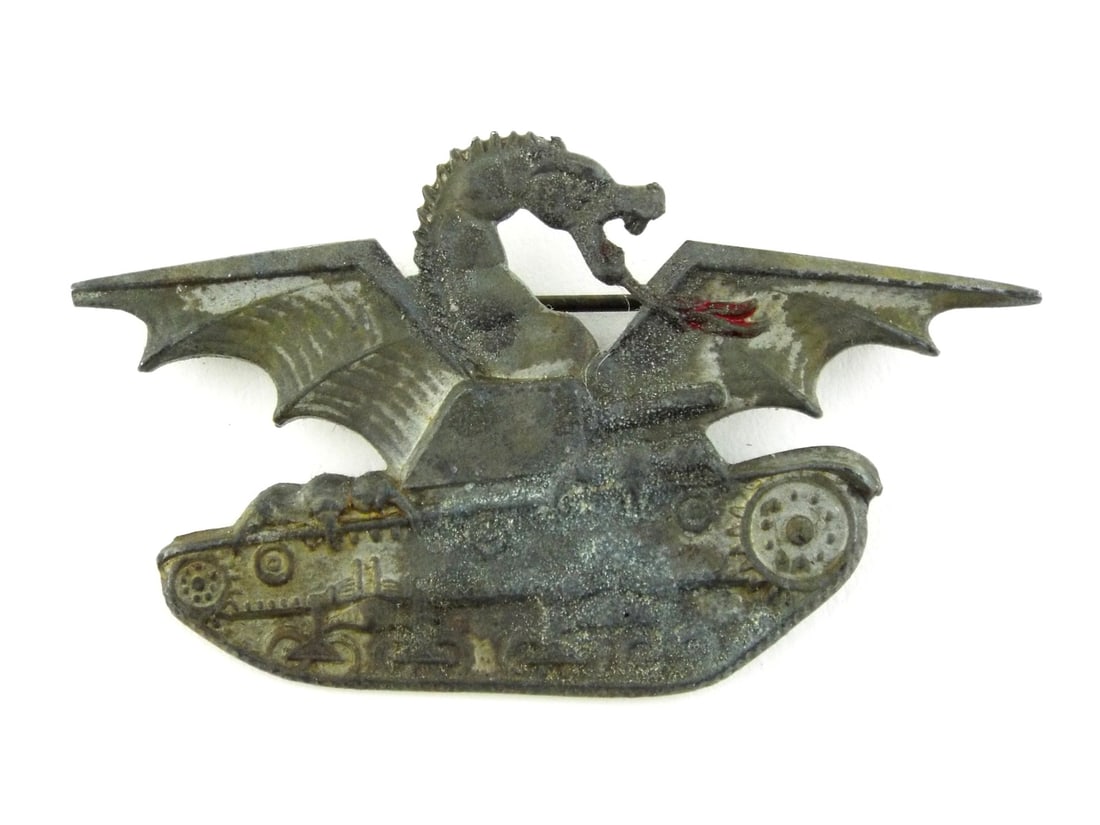 Italian WWII Carristi TANKER PIN Dragon Cut Out Motif: Die struck base body exhibiting heavy oxidation and granular surface wear. Silhouette depicts a Fiat tank surmounted by a winged dragon with traces of red enamel remaining on the tongue. Reverse featu