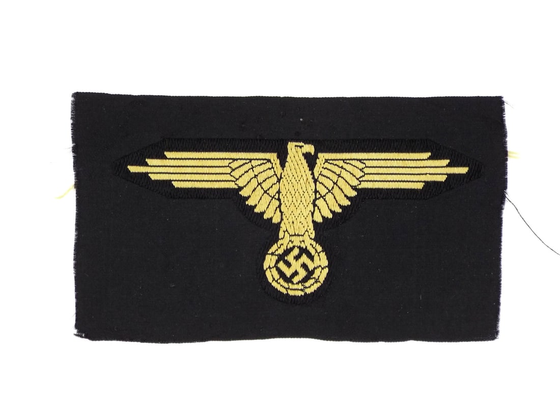 German WWII Waffen SS TROPICAL SLEEVE EAGLE Bevo Weave: Machine woven rayon body displays a superb golden tan eagle with a characteristic droop tail silhouette against a deep black warp. The textile ground exhibits minimal fraying with a stable weave struc