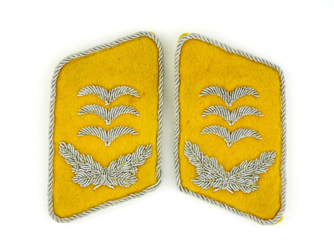 Pair of German WWII LUFTWAFFE OBERST COLLAR TABS Silver Bullion: Pair of golden yellow wool bodies displaying the characteristic hue of the Fliegertruppe and Fallschirmjager branches. The obverse features three hand embroidered silver bullion gulls positioned super