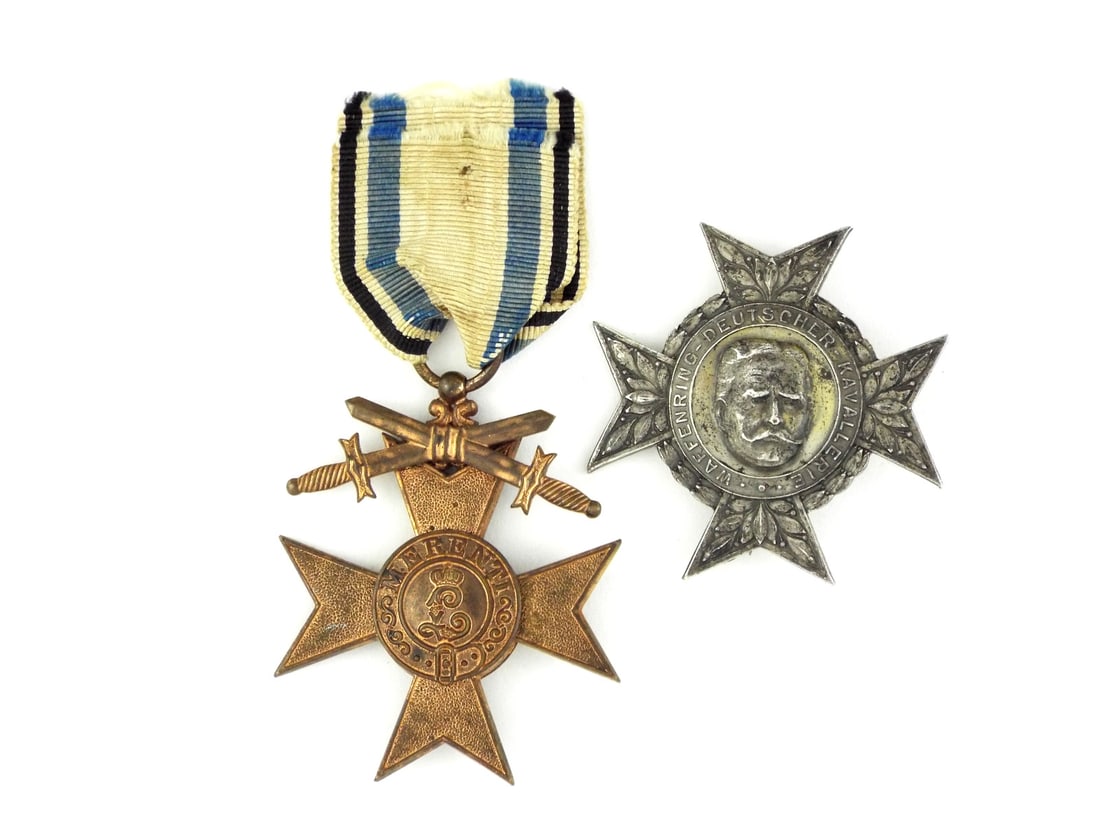 Bavarian WWI MILITARY MERIT CROSS & Hindenburg Cavalry Badge: Bronze cross features central Bavarian lion medallion dated 1866 and reverse monogram L for Ludwig II with Merenti - To the Meritorious inscription. Affixed crossed swords indicate combat grade, suspe