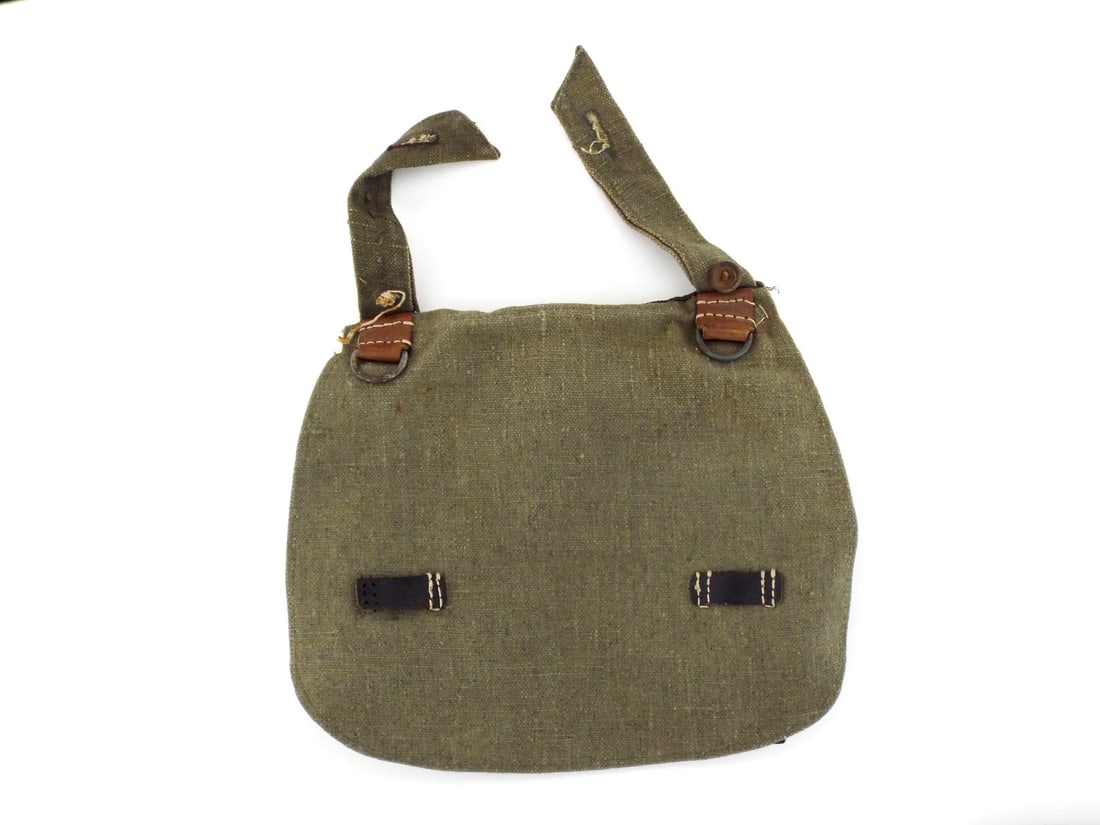 German WWII Heer Army Field Bread Bag: Heavy weight olive drab canvas body shows moderate field use with very light fraying at the perimeter. Two front leather tabs with steel D-rings remain intact though dry, one leather closure strap is
